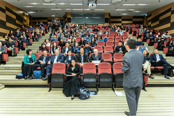 Man speaking in front of people at an event